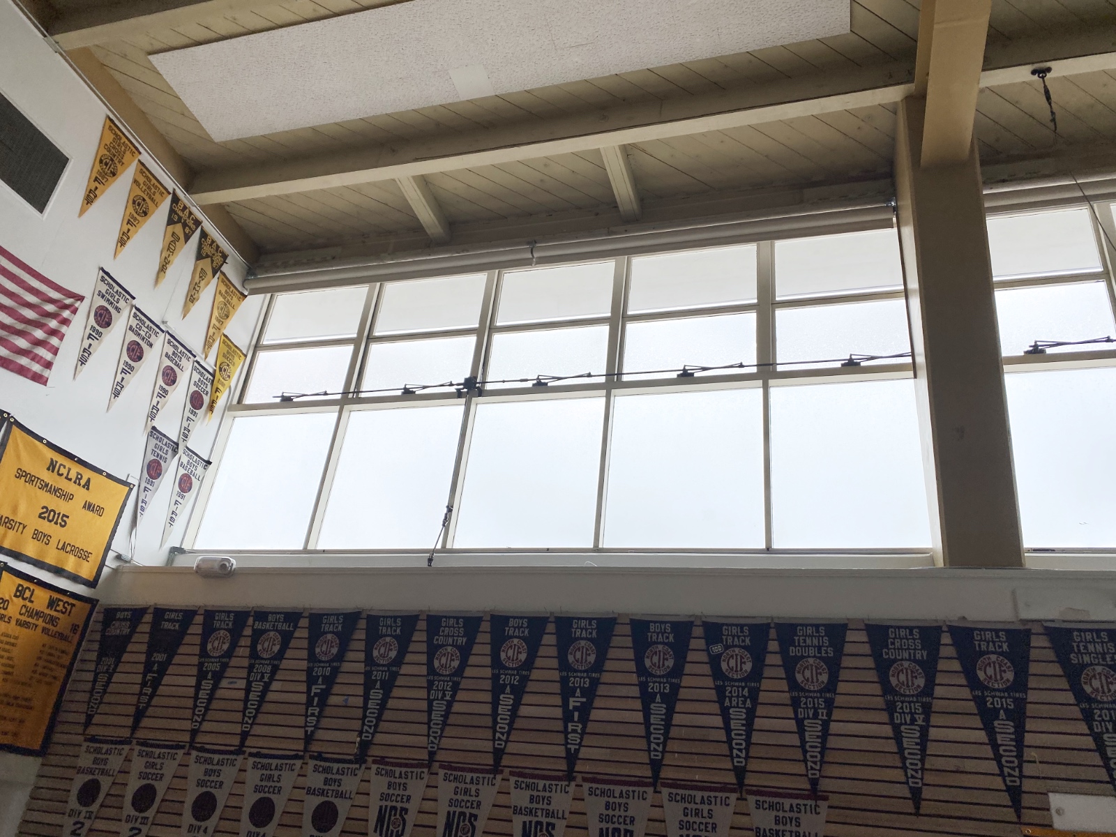 The completed window restoration in Lick-Wilmerding High School's historic gymnasium.